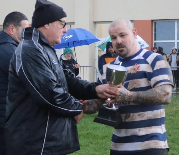 Robert Johns presents the silverware to Marc Jones